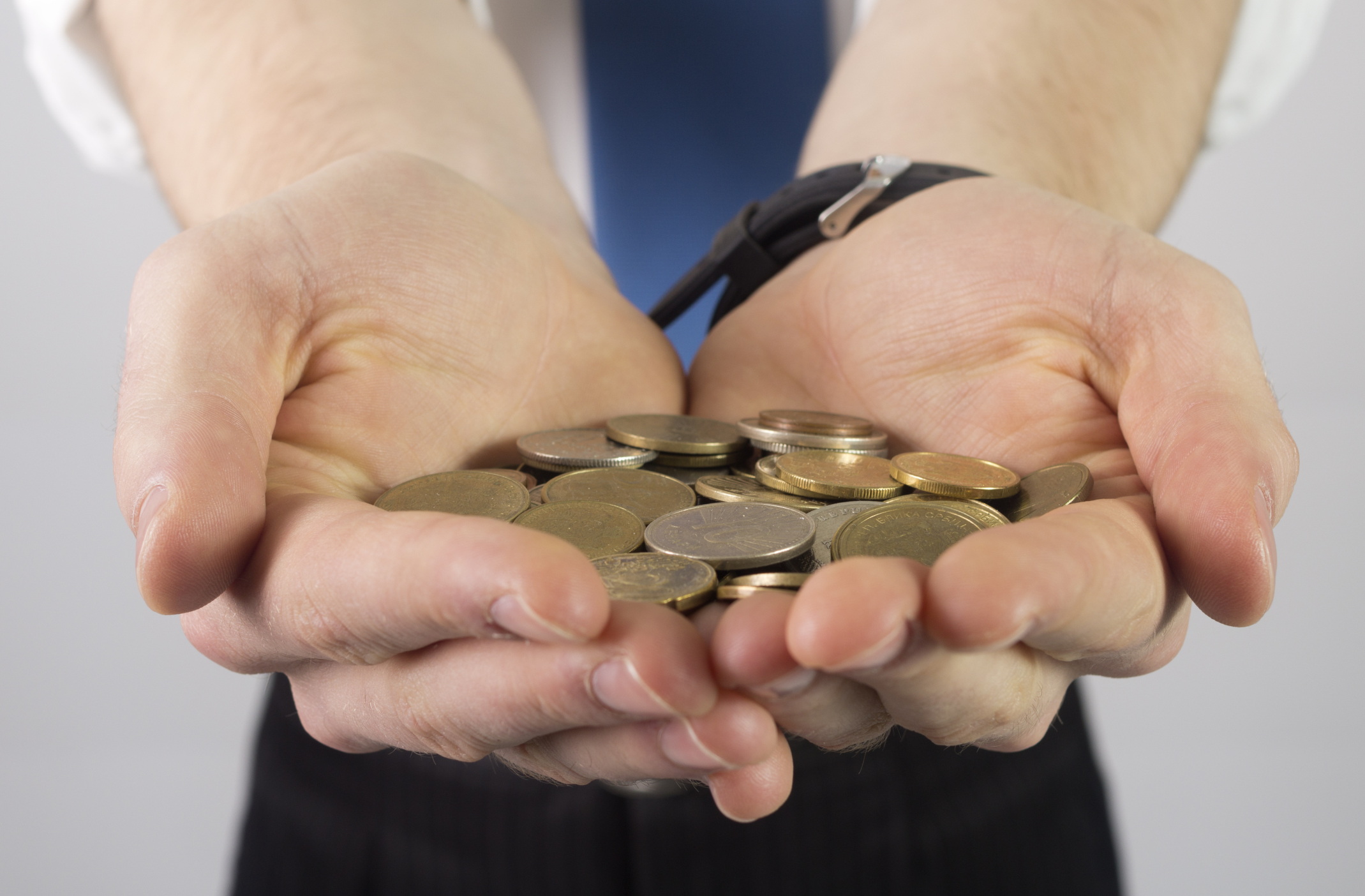 Businessman Holding Coins